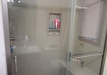 a bathroom with a shower and a shower