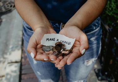 https://unsplash.com/photos/person-showing-both-hands-with-make-a-change-note-and-coins-K0E6E0a0R3A