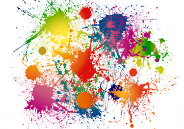 a colorful paint splattered background with a colorful paint splatter