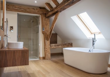 A modern bathroom in an oak barn