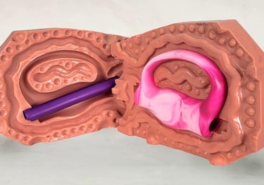 Picture of an open 2 piece silicone mold. The mold has a pink marbled grip in the mold cavity. 