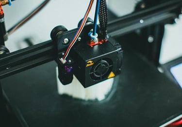 close up picture of a 3d printer printing a piece of art.