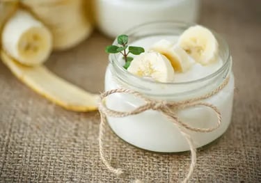 a jar of yogurt with bananas and yogurt