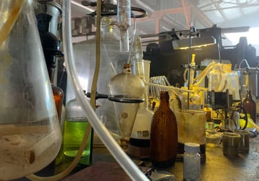 a bunch of bottles of liquid and chemicals in a illegal drug lab