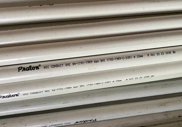 a stack of pipes and pipes in a warehouse HIC High impact Conduit Distributor Pralon
