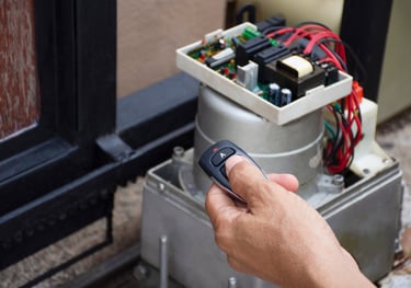 Gate motor being tested and repaired by a gate engineer
