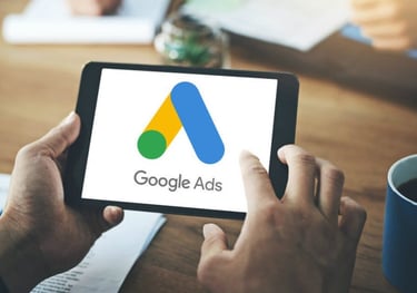a person holding a tablet with google ads