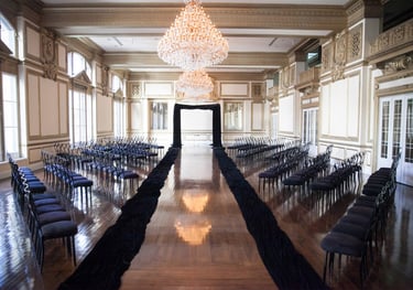 a long table with chairs and chairs in a room