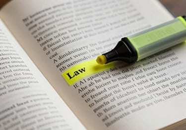 Macro shot of an open legal book with a yellow highlighter, focusing on text related to administrative law, soft indoor lighting.