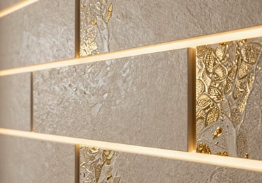A close-up shot of a textured luxury wall panel design with integrated lighting, showing off-white and gold color tones, South Asian / Indian home.