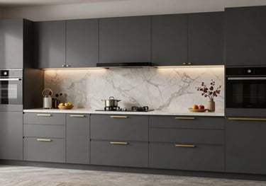 A professional photograph of a sleek, modern modular kitchen in a Ranchi residence, featuring dark grey cabinets and gold hardware.