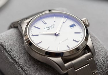 A close-up of a high-end luxury watch on a velvet cushion, its dial gleaming under studio lights, showcasing the results of professional servicing and polishing.