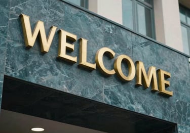 An architectural detail shot of a modern school entrance in Pakistan, showing gold lettering on a dark teal stone wall. The style is premium and welcoming.