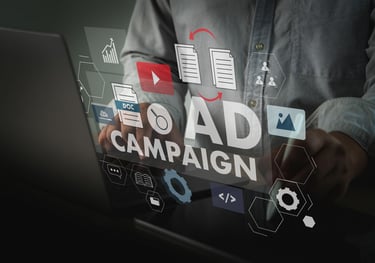 Digital marketer managing an online ad campaign on a laptop with holographic marketing icons and data analytics.