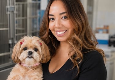 A smiling female veterinarian holding a small Shih Tzu dog in a modern pet clinic setting.