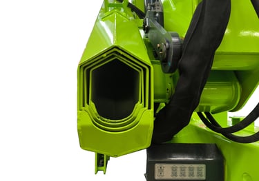 Close-up of green machine with attached hose, featuring hexagonal structure.