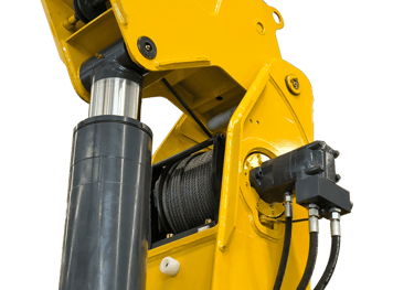 A close-up image of a hydraulic winch with a steel cable wrapped around a drum, used for heavy lifting and pulling tasks.