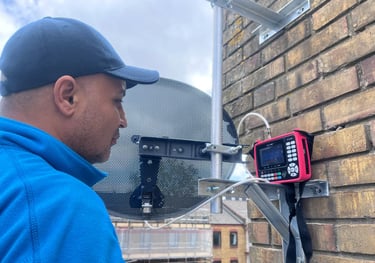man installing sky dish