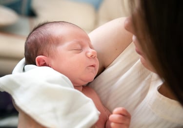 Newborn baby sleeping peacefully in cozy blanket