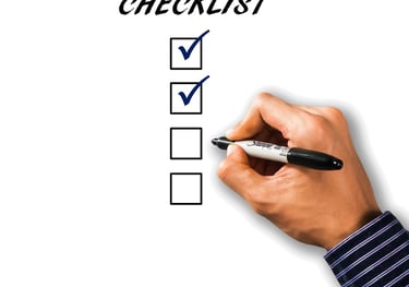 Flat lay of parenting guidebook and checklist resources for new moms