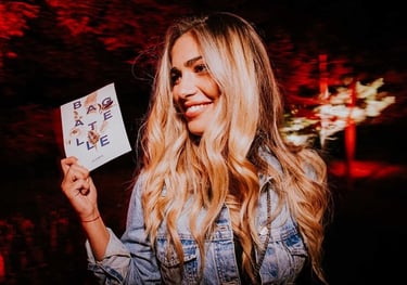 a woman holding a sign that says, i'm going to have a photo