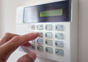 a person pressing a button on a keypad