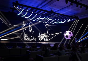 A visually stunning event space featuring a large custom LED backdrop displaying animated content 