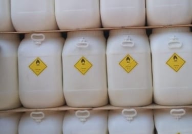 Bunch of white plastic containers with TCCA 90 granules