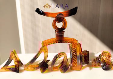 a group of hair accessories including a banan clip and a hair clip