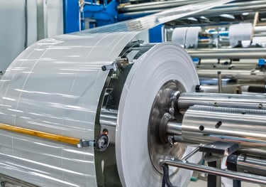 a machine that is making a paper roll