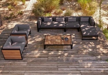 a couch with a wooden table and a table with a table and chairs