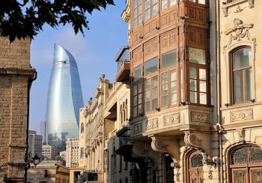 a building with a tall tower in the background