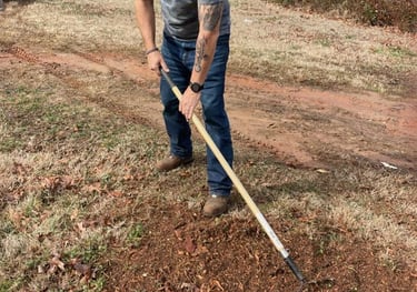 Cleaning up after stump grinding service.