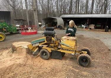 Stump grinding, woman-owned company.