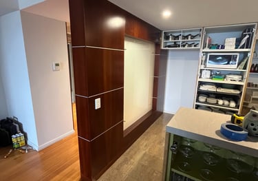 Modern white timber feature wall installation in residential kitchen