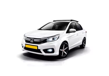 White Honda Amaze one way taxi by Saini taxi services with a luggage carrier rack
