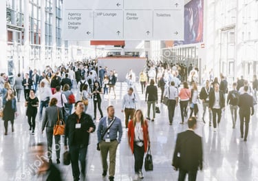 a group of people walking through a busy city