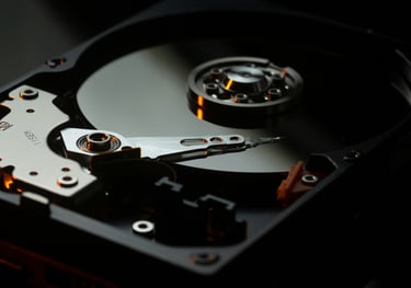 a photo of a hard drive with the platter exposed