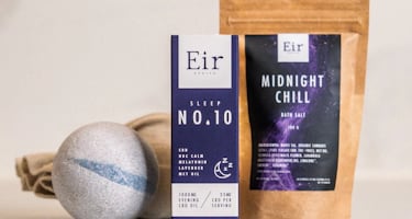 Several wellness products are arranged on a surface. There is a box labeled 'Eir Health Sleep No. 10