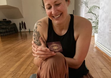 a woman sitting on a couch with a cake