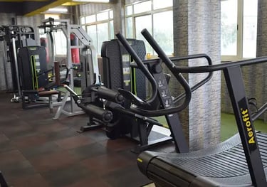 a gym room with a tread tread machine