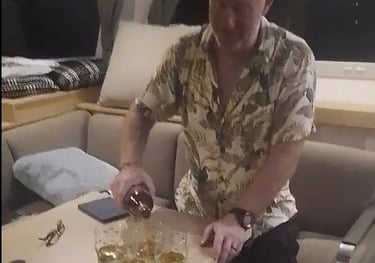 The crew toast Neptune as they cross the equator