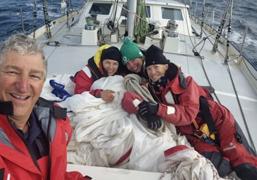 Happy crew working the spinnaker
