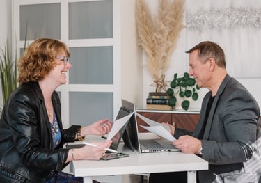 Allen and Susanne working together at a desk