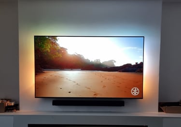 Professional TV wall mounting with hidden cabling in a Milton Keynes living room.