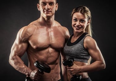 Personal trainer guiding a client during gym workout session