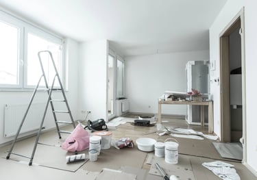a room with a ladder ready to be cleaned by avra cleaning services after bulders