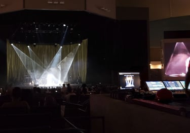 Front house stage view of a concert event.