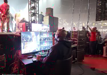 A video switcher at a multi-screen console.