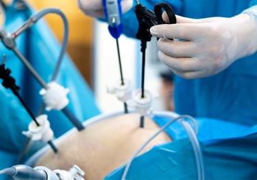 A surgeon preparing for a bariatric procedure in a fully equipped operating room.